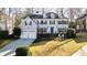 Charming two-story home with a blue front door and well-manicured lawn at 710 Greystone Ne Park, Atlanta, GA 30306