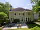 Charming exterior view of the house highlighting the back patio with stone flooring at 710 Greystone Ne Park, Atlanta, GA 30306