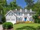 Charming two-story home with a manicured lawn, classic architectural design, and a welcoming three-car garage at 710 Greystone Ne Park, Atlanta, GA 30306
