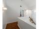 Hallway with wooden floors and modern lighting fixtures at 710 Greystone Ne Park, Atlanta, GA 30306