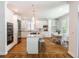 Eat-in kitchen boasts white cabinetry, stainless appliances, and granite countertops at 710 Greystone Ne Park, Atlanta, GA 30306