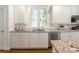 Modern kitchen featuring granite counters, stainless steel appliances and white cabinetry at 710 Greystone Ne Park, Atlanta, GA 30306