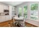 Kitchen dining nook with breakfast table and bright windows looking out to yard at 710 Greystone Ne Park, Atlanta, GA 30306