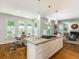 Kitchen island with granite countertop and pendant lighting open to breakfast nook at 710 Greystone Ne Park, Atlanta, GA 30306