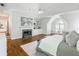 Sunlit main bedroom with fireplace, built-ins, and hardwood floors at 710 Greystone Ne Park, Atlanta, GA 30306