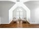 Cozy sitting area featuring hardwood floors, an arched window, and comfortable armchairs with soft pillows at 710 Greystone Ne Park, Atlanta, GA 30306