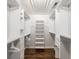 Well-organized walk-in closet with built-in shelving and drawers for optimal storage space at 710 Greystone Ne Park, Atlanta, GA 30306