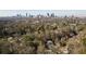 Drone shot of the home at 710 Greystone Park NE, highlighting its location within a neighborhood near the Atlanta skyline at 710 Greystone Ne Park, Atlanta, GA 30306