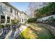 Serene backyard space featuring a flagstone patio and lush landscaping for outdoor enjoyment at 710 Greystone Ne Park, Atlanta, GA 30306