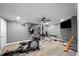 Finished basement featuring laminate floors and a fully-equipped home gym with a television for at-home fitness at 710 Greystone Ne Park, Atlanta, GA 30306