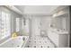 Bathroom features a soaking tub, walk-in shower, and double vanity with ample counter space at 710 Greystone Ne Park, Atlanta, GA 30306