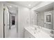 Clean and bright bathroom with a white vanity, large mirror, and tiled floors at 710 Greystone Ne Park, Atlanta, GA 30306