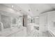 This image shows a bathroom with double sinks, a glass block window, and a soaking tub at 710 Greystone Ne Park, Atlanta, GA 30306