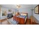 Bright bedroom with a comfortable bed, an office space, and large windows offering natural light at 710 Greystone Ne Park, Atlanta, GA 30306