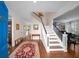Inviting foyer with hardwood floors, staircase, and views into adjacent rooms at 710 Greystone Ne Park, Atlanta, GA 30306