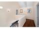 Bright hallway featuring hardwood floors, neutral paint, and artwork on the walls at 710 Greystone Ne Park, Atlanta, GA 30306