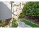 Landscaped walkway with stone steps, providing an inviting pathway through the garden at 710 Greystone Ne Park, Atlanta, GA 30306
