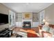 Comfortable living room with a fireplace, built-in shelving, and views into the backyard at 710 Greystone Ne Park, Atlanta, GA 30306