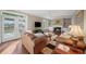 Bright living room with hardwood floors, french doors, fireplace and built-in shelving at 710 Greystone Ne Park, Atlanta, GA 30306