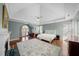 Spacious main bedroom featuring a fireplace, ceiling fan, and hardwood flooring at 710 Greystone Ne Park, Atlanta, GA 30306