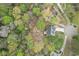 Scenic view of a property nestled among mature trees in a quiet neighborhood at 1007 Springharbor Walk, Woodstock, GA 30188