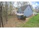 Two-story home with a white railing deck and landscaped backyard at 1007 Springharbor Walk, Woodstock, GA 30188