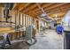 Spacious basement has exposed ceilings and concrete flooring, offering a versatile area for storage or other activities at 1007 Springharbor Walk, Woodstock, GA 30188