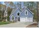 Charming home featuring a well-manicured lawn, two-car garage, and attractive curb appeal at 1007 Springharbor Walk, Woodstock, GA 30188