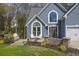 This home offers a well-manicured lawn, charming patio, and attractive curb appeal at 1007 Springharbor Walk, Woodstock, GA 30188