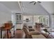 Bright living room with vaulted ceilings, open concept to the kitchen and dining area at 1007 Springharbor Walk, Woodstock, GA 30188