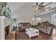 Bright living room with vaulted ceilings, fireplace, and hardwood floors for comfortable modern living at 1007 Springharbor Walk, Woodstock, GA 30188