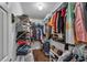 Fully organized walk-in closet with extensive shelving and hanging space for optimal storage at 1007 Springharbor Walk, Woodstock, GA 30188