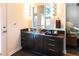 Modern bathroom with glass sink bowl, cabinet and mirror plus plenty of natural light at 1428 Brook Valley Ne Ln, Atlanta, GA 30324