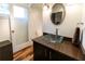 This bathroom features a unique glass vessel sink, modern fixtures, and a stylish oval mirror at 1428 Brook Valley Ne Ln, Atlanta, GA 30324