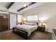 The main bedroom features a bed, side tables, closet, and a large window at 1428 Brook Valley Ne Ln, Atlanta, GA 30324