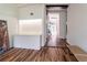 Bright entryway featuring hardwood floors, a built-in storage unit with lighting and an open floorplan at 1428 Brook Valley Ne Ln, Atlanta, GA 30324