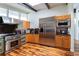 Gourmet kitchen features stainless appliances, granite countertops and natural wood cabinets at 1428 Brook Valley Ne Ln, Atlanta, GA 30324