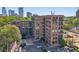 Aerial view of the brick exterior of Buckhead Village Lofts in a vibrant cityscape at 3235 Roswell Ne Rd # 801, Atlanta, GA 30305