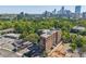 Aerial view of Buckhead Village Lofts with beautiful treetop and cityscape views at 3235 Roswell Ne Rd # 801, Atlanta, GA 30305