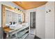 Bathroom featuring double sink vanity, wood ceiling and modern finishes at 3235 Roswell Ne Rd # 801, Atlanta, GA 30305