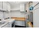 Bright laundry room with white subway tile backsplash, wooden countertop, and modern washer and dryer at 3235 Roswell Ne Rd # 801, Atlanta, GA 30305