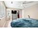 Bright bedroom with ceiling fan, closet, dresser, and ensuite bathroom, providing ample storage and convenience at 3385 Huntington Ct, Douglasville, GA 30134