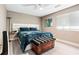 Comfortable bedroom featuring a modern bed, ceiling fan, and wood-look flooring, providing a serene retreat at 3385 Huntington Ct, Douglasville, GA 30134