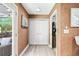 Hallway featuring vinyl flooring, closet storage space, and natural light from the outdoor patio at 3385 Huntington Ct, Douglasville, GA 30134