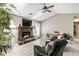 Inviting living room features a stone fireplace, vaulted ceilings with a skylight, and comfortable seating at 3385 Huntington Ct, Douglasville, GA 30134
