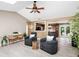 Open-concept living room with views to the kitchen, offering cozy seating and stylish decor at 3385 Huntington Ct, Douglasville, GA 30134