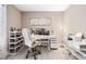 Bright home office with a modern desk, comfortable chair, and natural light from the large window at 3385 Huntington Ct, Douglasville, GA 30134