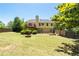 Large backyard with a deck, a fire pit and fenced perimeter, perfect for outdoor activities at 3540 Owl Brow Ct, Cumming, GA 30028