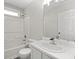 Bathroom with a tub and shower, a white vanity, and a large mirror at 3540 Owl Brow Ct, Cumming, GA 30028
