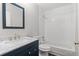 The bathroom offers tiled walls and a sleek vanity with granite countertops at 3540 Owl Brow Ct, Cumming, GA 30028